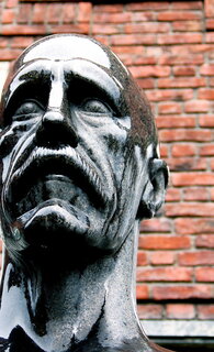Grief - A statue in Oslo. in the rain (licensed CC BY by Todd Huffman)